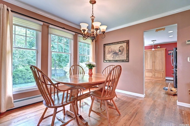 150 N Woods Dr, Wading River, NY 11792 - dining space featuring crown molding, baseboards, light wood finished floors, and a notable chandelier