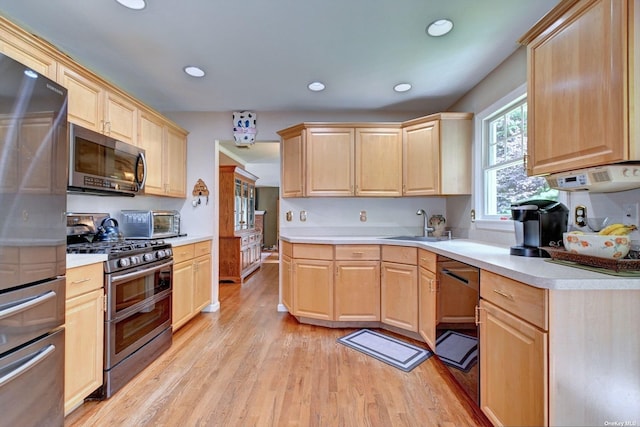 150 N Woods Dr, Wading River, NY 11792 - kitchen featuring light countertops, light brown cabinetry, and appliances with stainless steel finishes