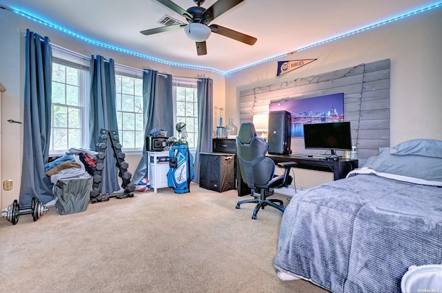 150 N Woods Dr, Wading River, NY 11792 - carpeted bedroom with visible vents, multiple windows, and a ceiling fan