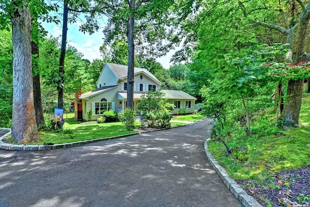 150 N Woods Dr, Wading River, NY 11792 - view of front facade with a front yard and driveway