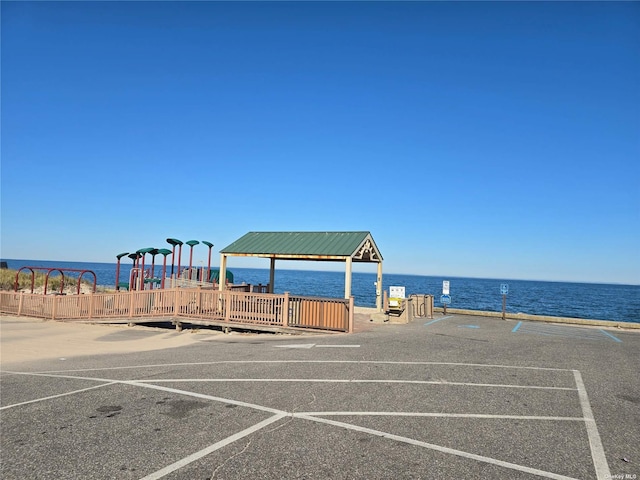 150 N Woods Dr, Wading River, NY 11792 - view of vehicle parking with playground community and a water view