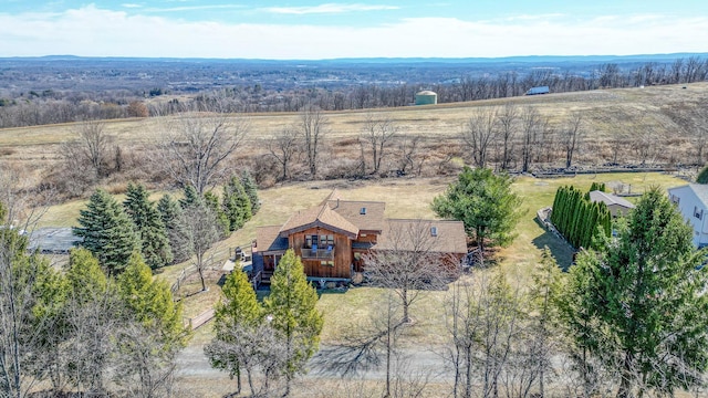 birds eye view of property with a rural view