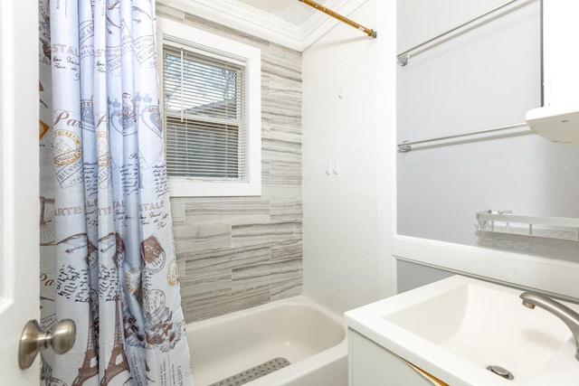 full bathroom with shower / bath combo with shower curtain and a sink