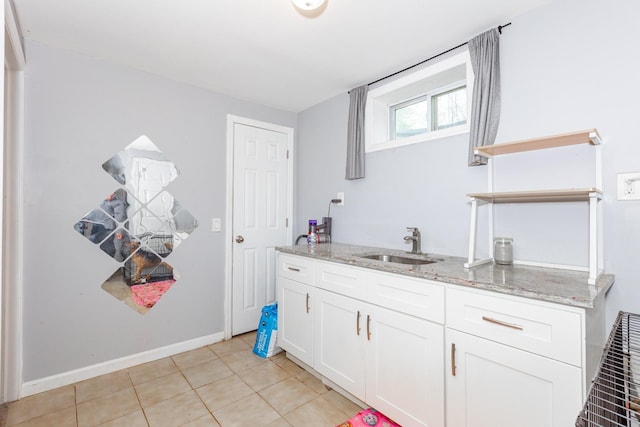 bathroom featuring tile patterned floors, baseboards, and vanity