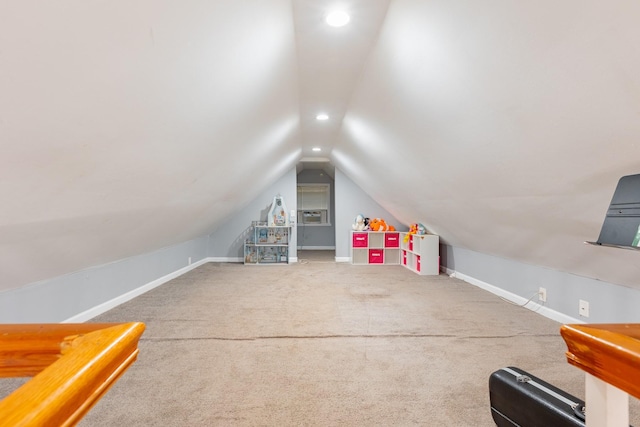 additional living space with carpet floors, recessed lighting, baseboards, and lofted ceiling