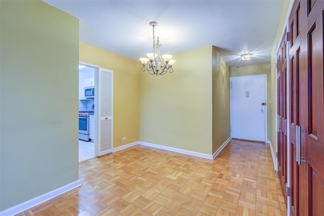 102-30 66th Rd Unit 5A, Forest Hills, NY 11375 - spare room featuring a chandelier and baseboards