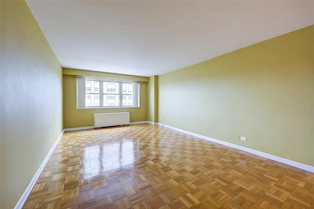 102-30 66th Rd Unit 5A, Forest Hills, NY 11375 - unfurnished room with radiator and baseboards