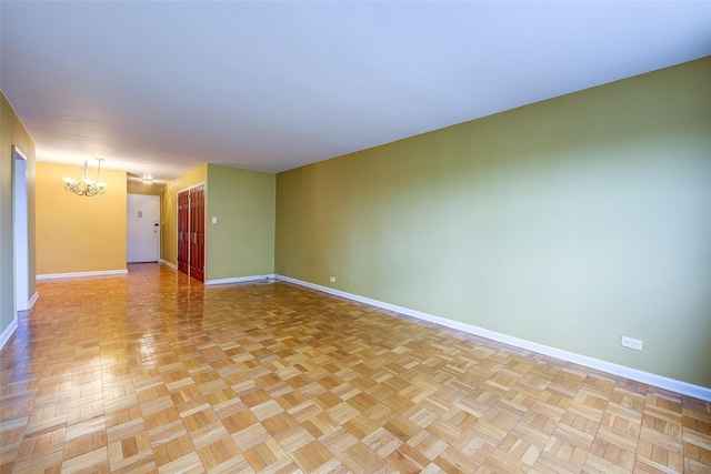 102-30 66th Rd Unit 5A, Forest Hills, NY 11375 - unfurnished room with baseboards and a chandelier