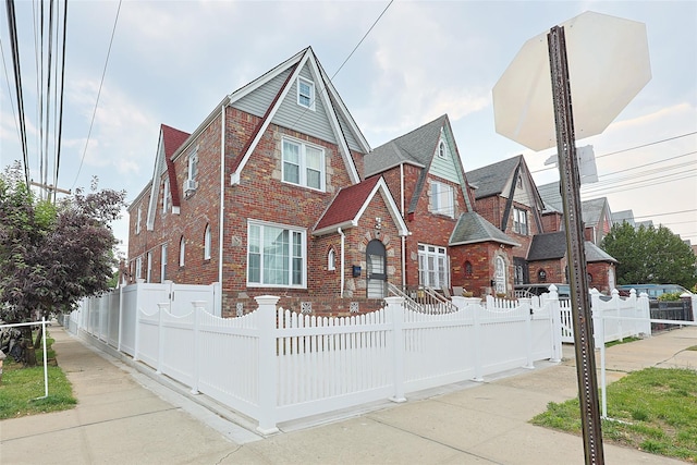 191-68 115th Rd, Saint Albans, NY 11412 - view of front of house featuring brick siding and a fenced front yard