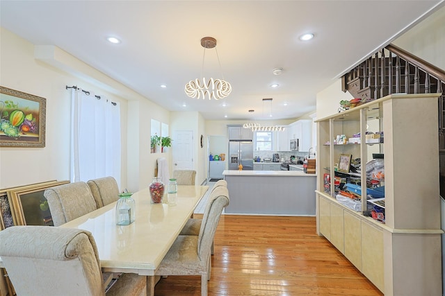 191-68 115th Rd, Saint Albans, NY 11412 - dining room featuring light wood-style flooring, recessed lighting, and a chandelier