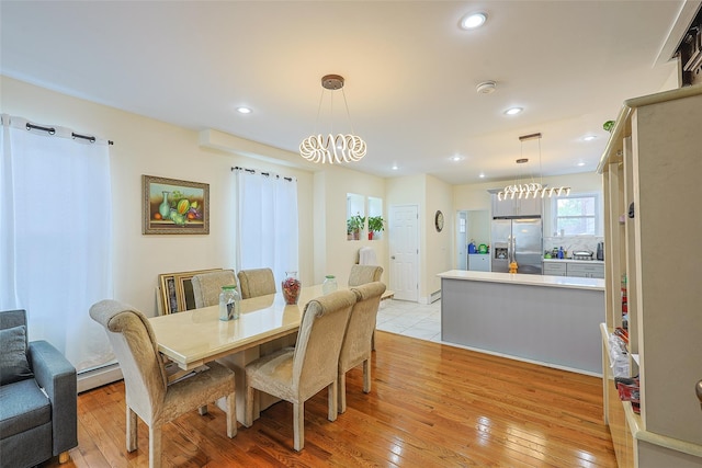 191-68 115th Rd, Saint Albans, NY 11412 - dining space with a chandelier, light wood finished floors, baseboard heating, and recessed lighting