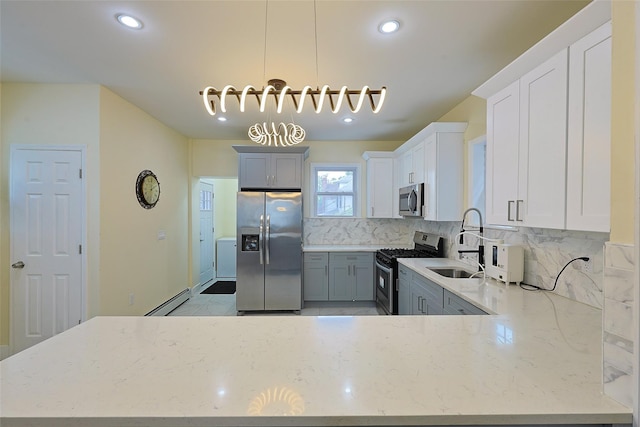 191-68 115th Rd, Saint Albans, NY 11412 - kitchen with stainless steel appliances, a sink, light stone countertops, backsplash, and recessed lighting