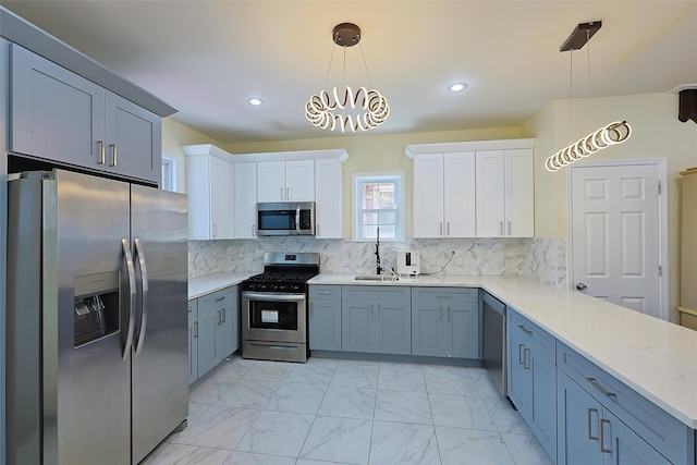 191-68 115th Rd, Saint Albans, NY 11412 - kitchen featuring appliances with stainless steel finishes, white cabinetry, light marble finish floors, backsplash, and recessed lighting