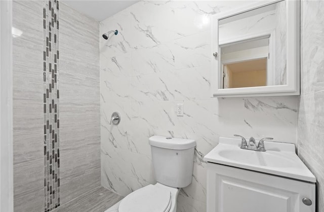 191-68 115th Rd, Saint Albans, NY 11412 - bathroom with tile walls, tiled shower, toilet, and vanity
