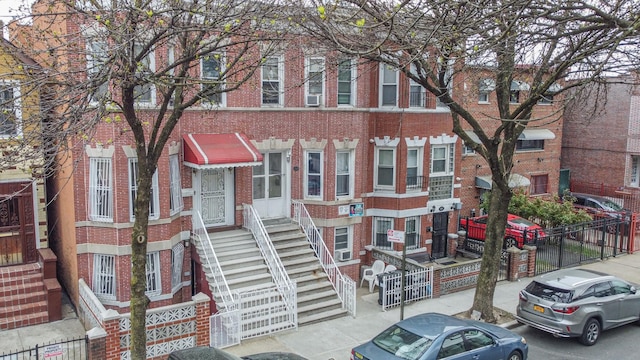 1222 Taylor Ave, Bronx, NY 10472 - view of property with fence and brick siding
