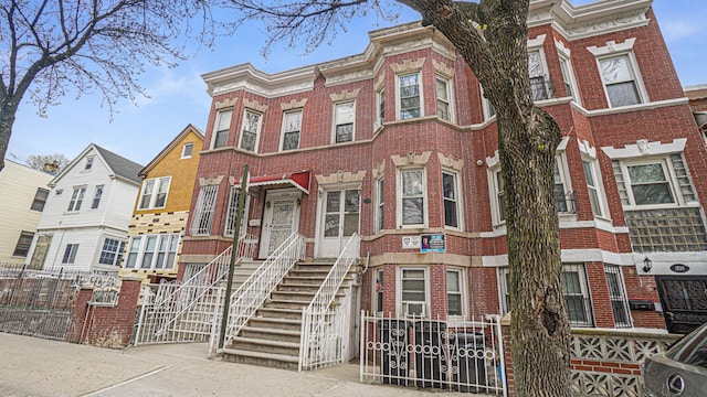 1222 Taylor Ave, Bronx, NY 10472 - view of property with brick siding and fence