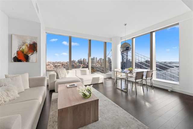 living room featuring a view of city, visible vents, and dark wood-type flooring