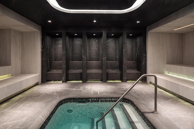 view of swimming pool featuring an indoor in ground hot tub