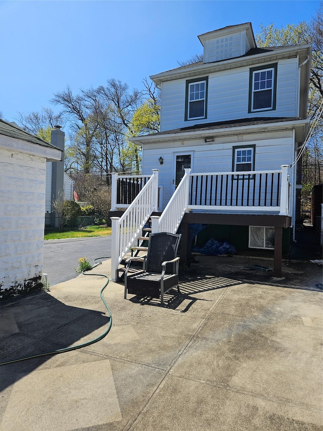 182 Parkway N, Yonkers, NY 10704 - view of front of home with stairway, a deck, and a patio