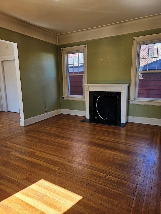 182 Parkway N, Yonkers, NY 10704 - unfurnished living room featuring a high end fireplace, wood finished floors, a wealth of natural light, and baseboards