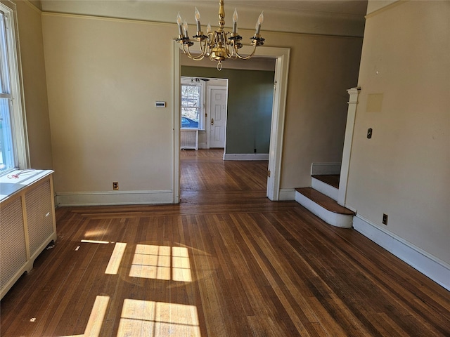 182 Parkway N, Yonkers, NY 10704 - unfurnished dining area featuring radiator, a chandelier, hardwood / wood-style floors, and baseboards