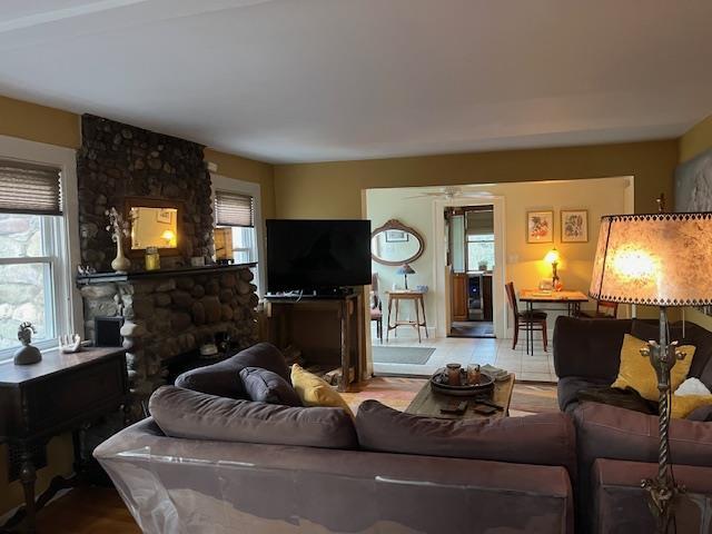 living area with a ceiling fan