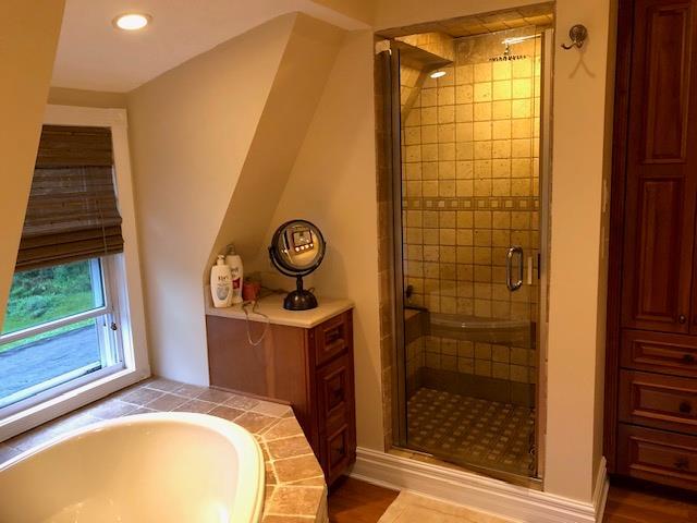 full bathroom featuring a garden tub, recessed lighting, and a stall shower