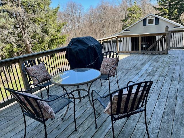 wooden deck with grilling area