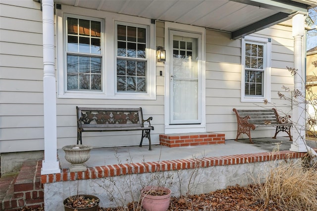 property entrance featuring covered porch
