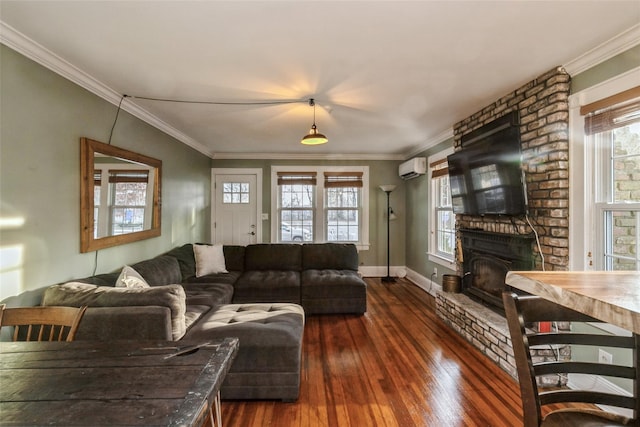 living area with crown molding, an AC wall unit, and dark wood finished floors