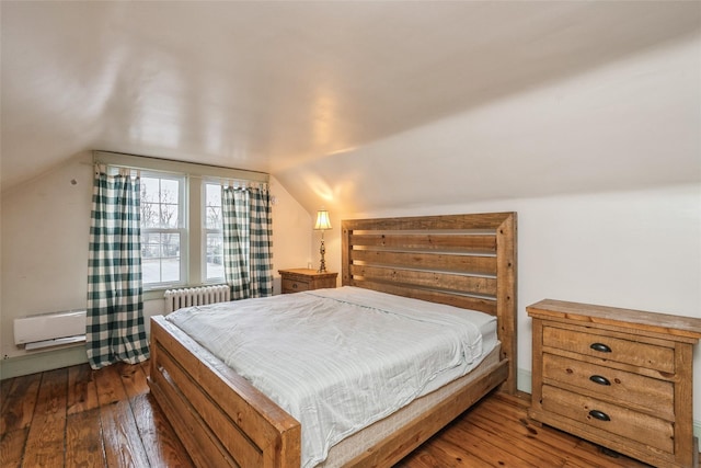 bedroom featuring vaulted ceiling, baseboards, dark wood-type flooring, and radiator
