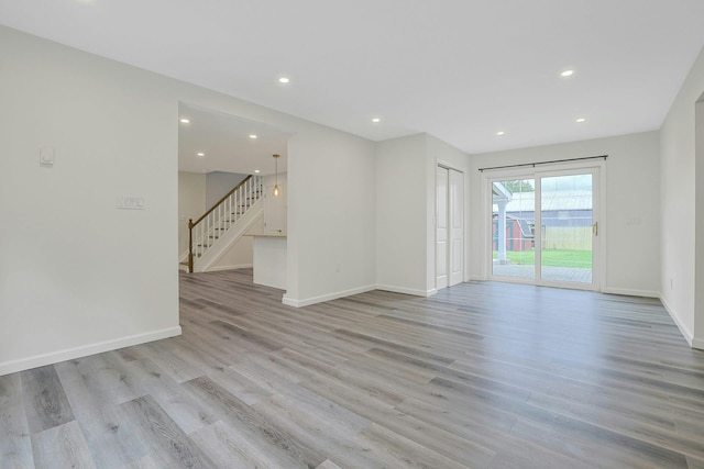 286 9th St, Verplanck, NY 10596 - spare room featuring stairway, light wood-style flooring, recessed lighting, and baseboards