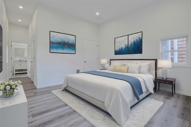 286 9th St, Verplanck, NY 10596 - bedroom featuring light wood-type flooring, baseboards, recessed lighting, and ensuite bathroom