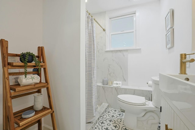 286 9th St, Verplanck, NY 10596 - bathroom with toilet, vanity, and tile patterned flooring