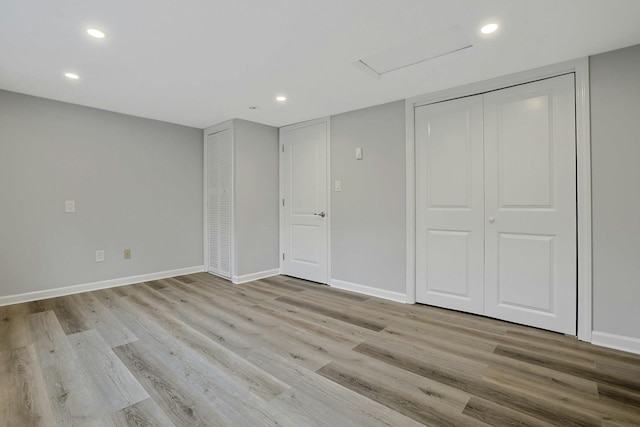 286 9th St, Verplanck, NY 10596 - unfurnished bedroom with wood finished floors, recessed lighting, and baseboards