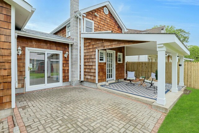 286 9th St, Verplanck, NY 10596 - rear view of property with roof with shingles, a chimney, and a patio area