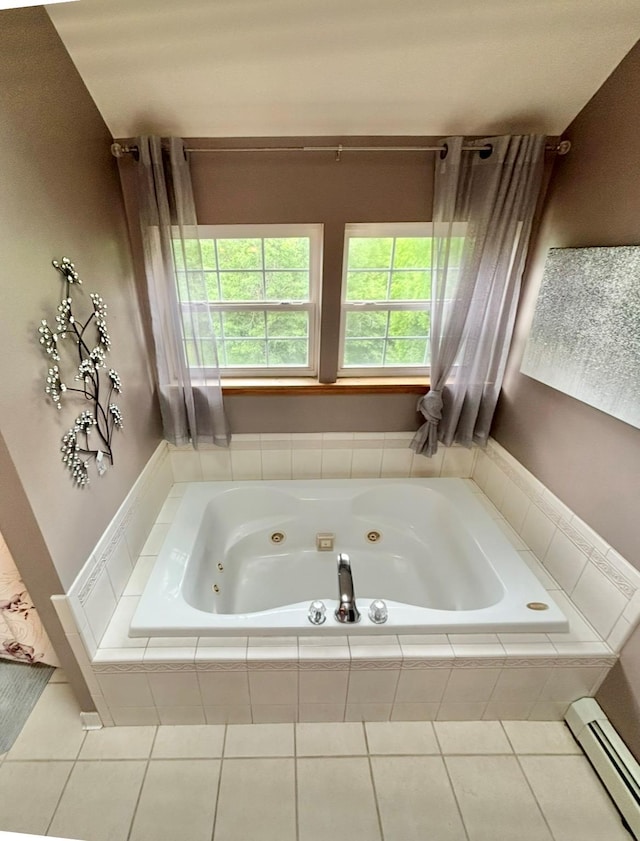 full bath featuring a tub with jets, a baseboard radiator, and tile patterned flooring