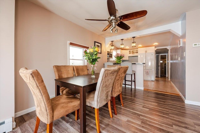 92 Nebraska St, Long Beach, NY 11561 - dining space featuring a baseboard radiator, wood finished floors, a ceiling fan, and baseboards