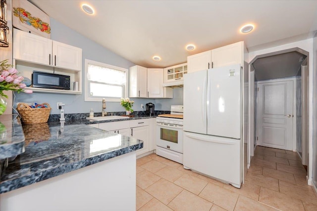 92 Nebraska St, Long Beach, NY 11561 - kitchen featuring a sink, white appliances, white cabinets, lofted ceiling, and under cabinet range hood
