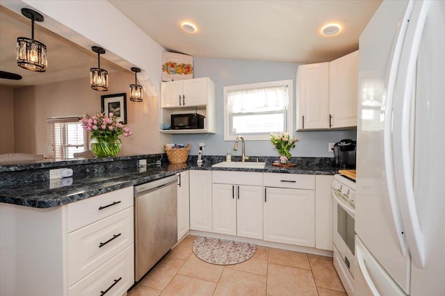 92 Nebraska St, Long Beach, NY 11561 - kitchen featuring white cabinets, a sink, white appliances, a peninsula, and hanging light fixtures