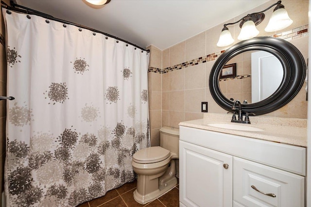 92 Nebraska St, Long Beach, NY 11561 - full bath with tile patterned floors, vanity, tile walls, a shower with curtain, and toilet