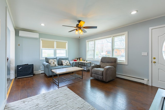 living room with wood finished floors, a ceiling fan, a wall unit AC, ornamental molding, and baseboard heating