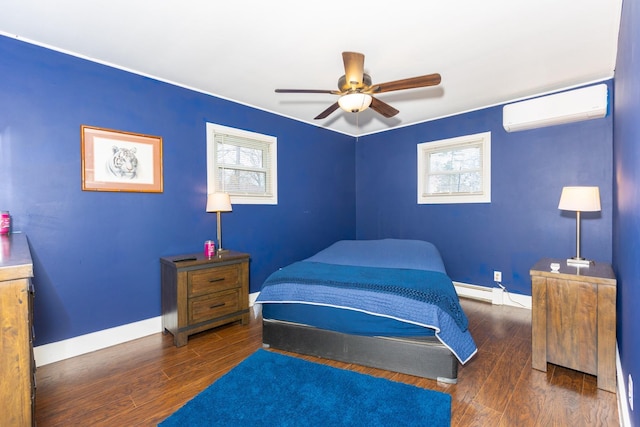 bedroom featuring multiple windows, wood finished floors, and a wall mounted air conditioner