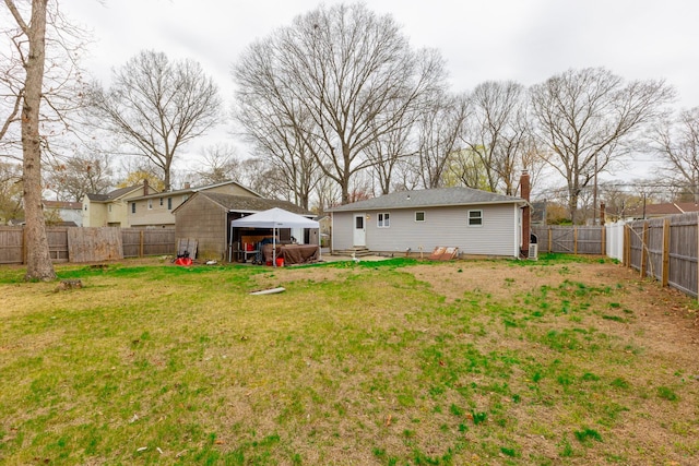 view of yard with a fenced backyard