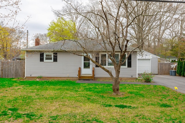 single story home featuring fence, a front lawn, driveway, and a chimney