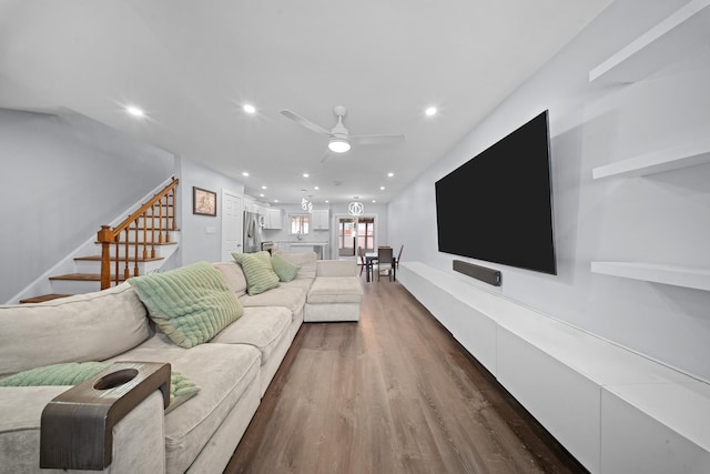 living area featuring a ceiling fan, stairs, dark wood-style floors, and recessed lighting
