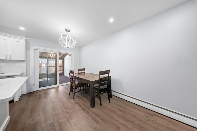 dining room with dark wood-style floors, recessed lighting, a chandelier, and a baseboard radiator