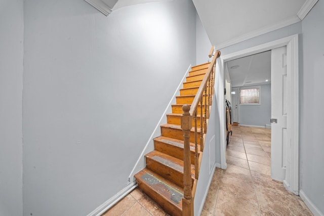 staircase featuring baseboards