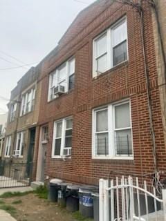1914 Holland Ave, Bronx, NY 10462 - view of home's exterior with brick siding and fence