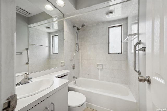 full bath featuring vanity, toilet, visible vents, and bathing tub / shower combination